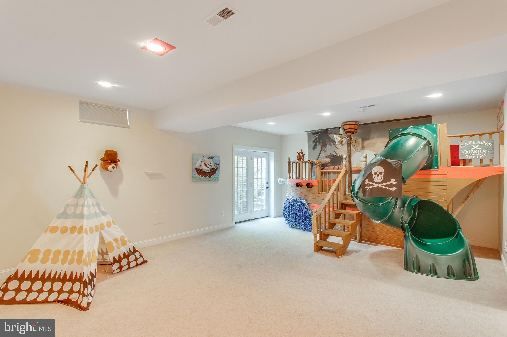 8037 Washington Road Alexandria, VA 22308 - Photo 23 of 30 Walk-out rec room perfect for relaxation and play
