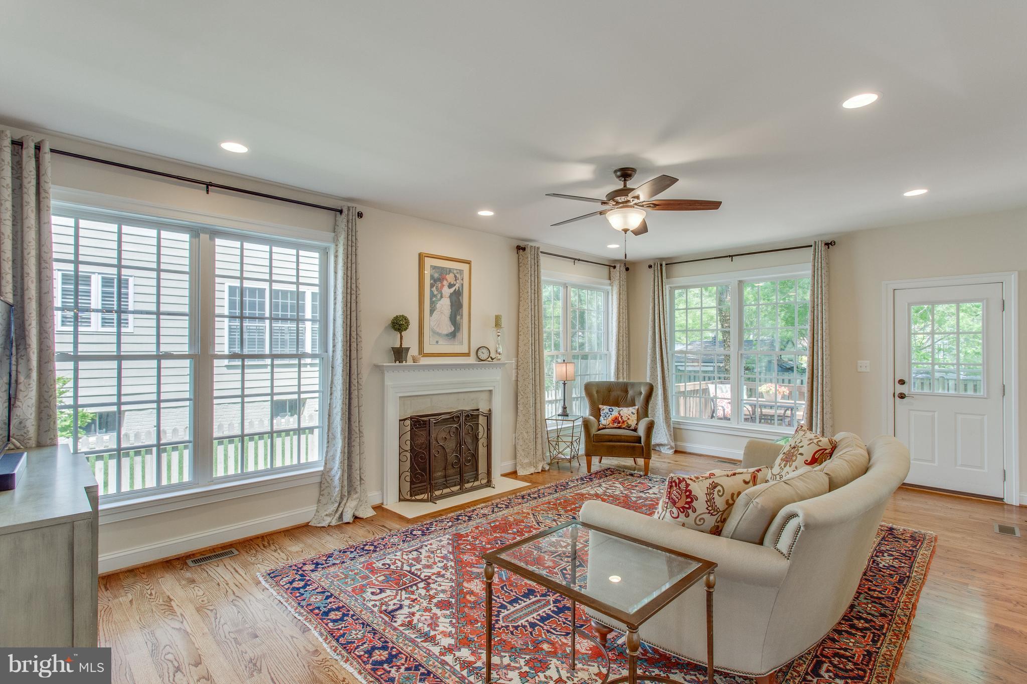 8037 Washington Road Alexandria, VA 22308 - Photo 4 of 30 Sun-drenched family room with Lennox gas fireplace