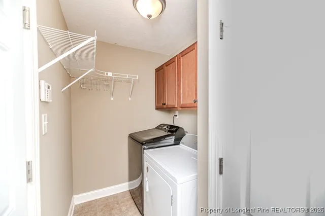 a view of storage and utility room with washer and dryer