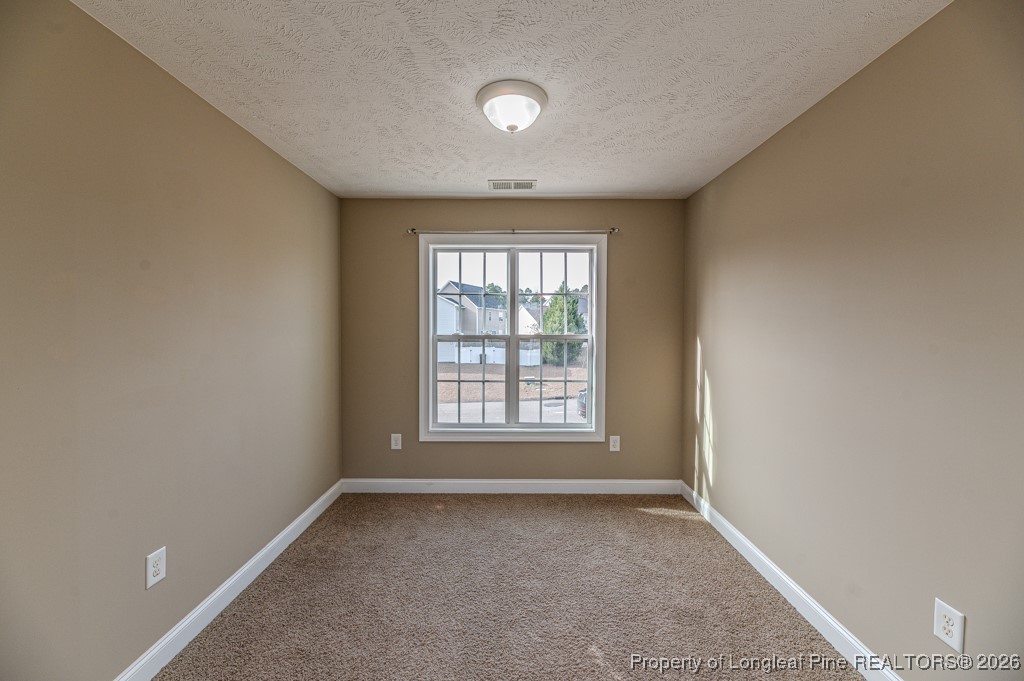 255 Trenton Place Cameron, NC 28326 - Photo 21 of 49 a view of an empty room with a window