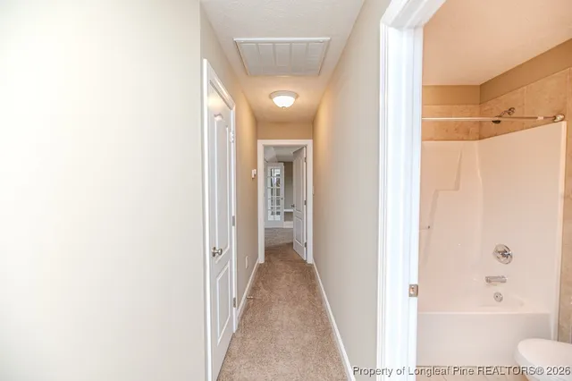a view of a bathroom with a bathtub