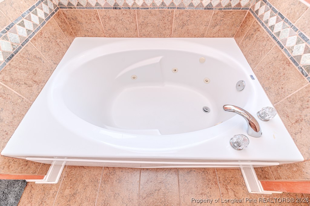 255 Trenton Place Cameron, NC 28326 - Photo 25 of 49 a bathroom with a bathtub