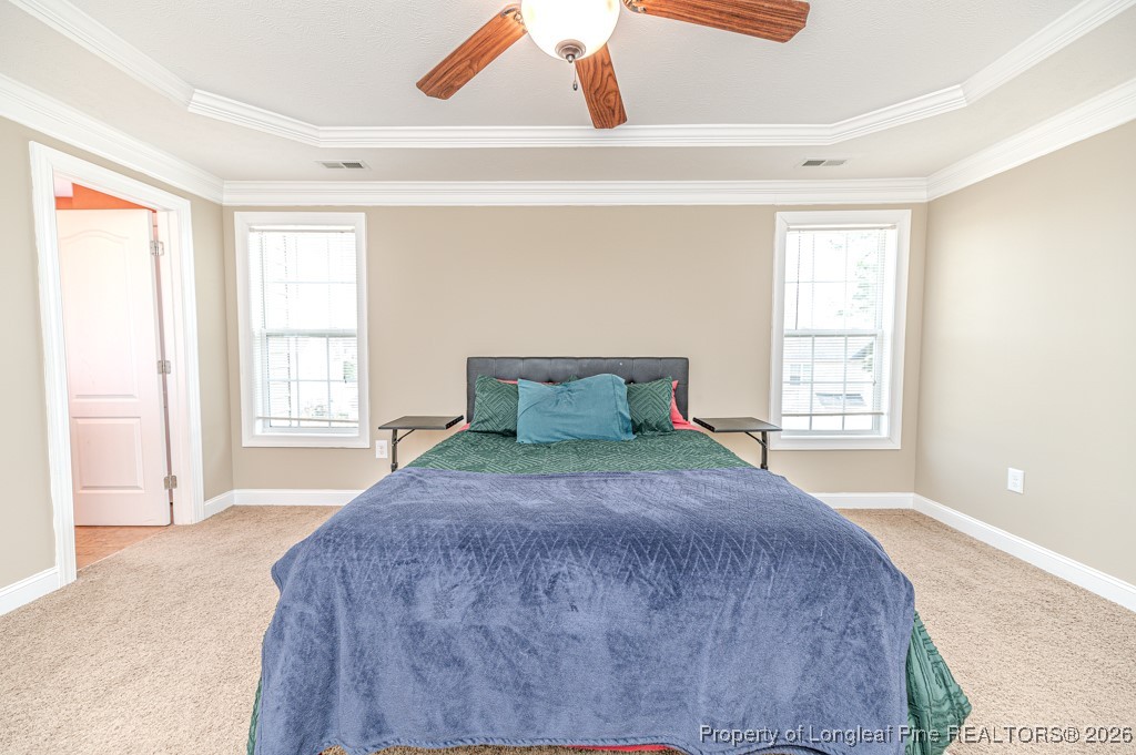 255 Trenton Place Cameron, NC 28326 - Photo 29 of 49 a large bed sitting in a bedroom next to a window