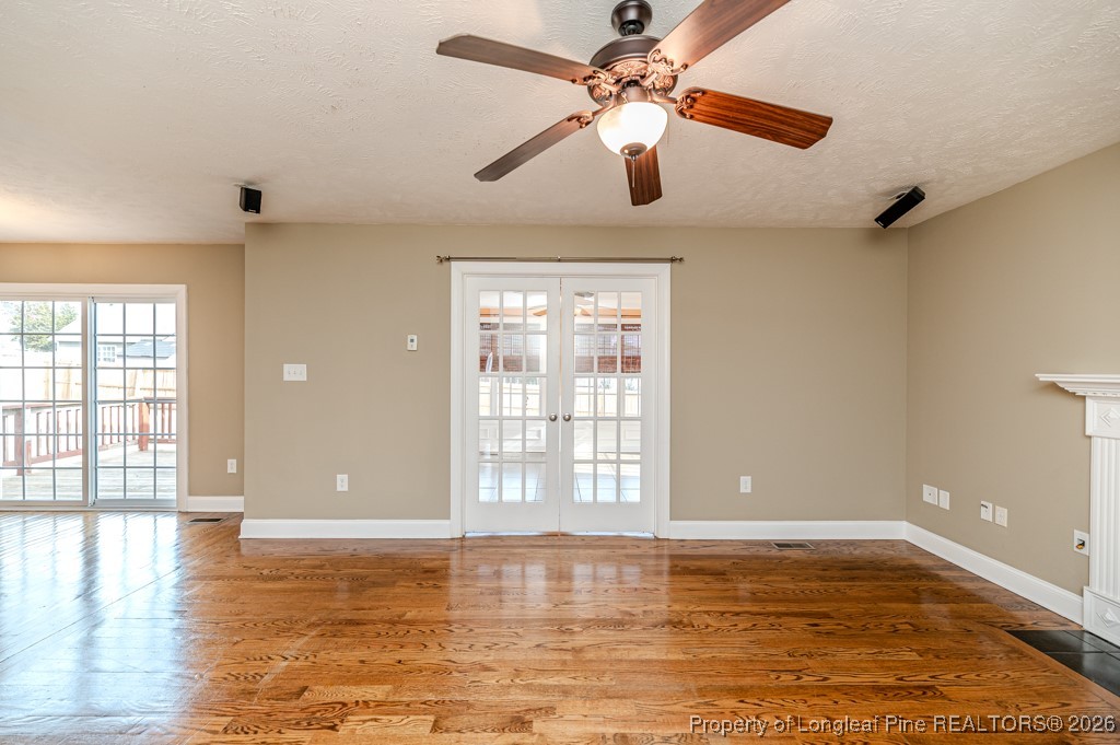 255 Trenton Place Cameron, NC 28326 - Photo 43 of 49 a view of an empty room with window and wooden floor