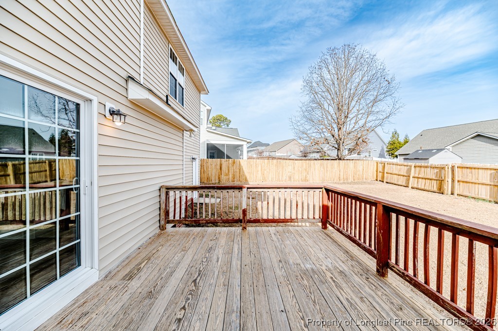 255 Trenton Place Cameron, NC 28326 - Photo 49 of 49 a view of a wooden deck with a yard