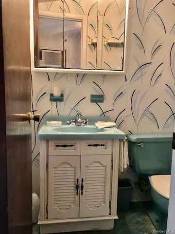 a bathroom with a sink and mirror