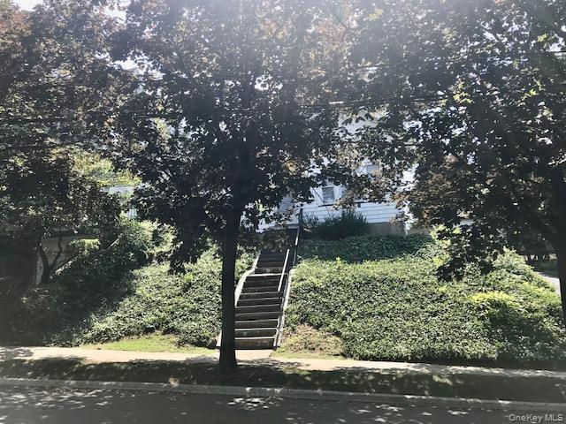 52 Nassau Road Great Neck, NY 11021 - Photo 13 of 17 View of property hidden behind natural elements featuring stairs