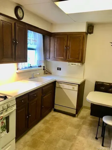 a spacious bathroom with a sink and a mirror