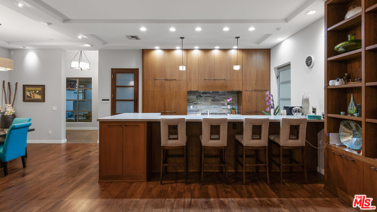 7350 Rindge Avenue Playa del Rey, CA 90293 - Photo 16 of 55 a large kitchen with a table and chairs