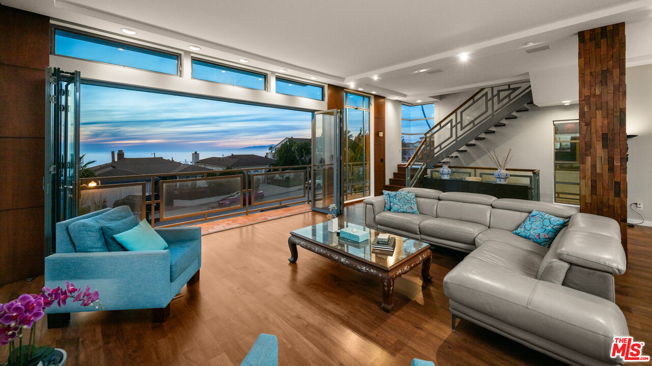 7350 Rindge Avenue Playa del Rey, CA 90293 - Photo 21 of 55 a living room with furniture and a floor to ceiling window