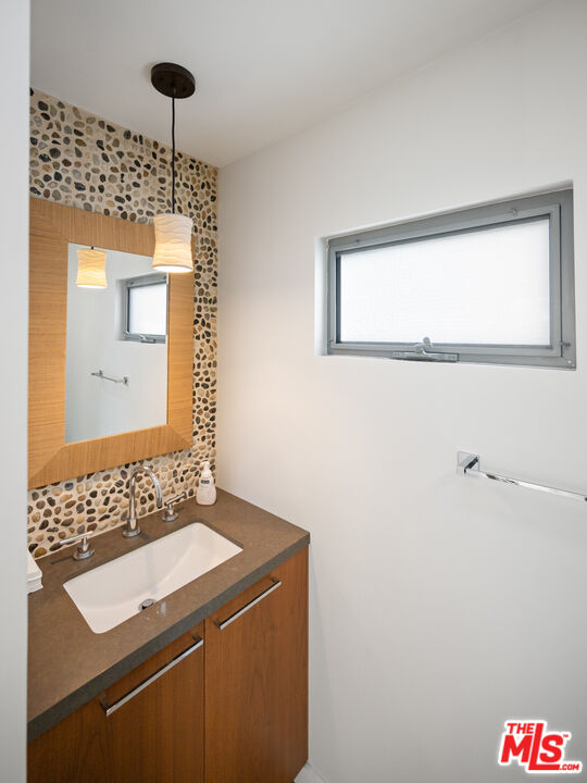 7350 Rindge Avenue Playa del Rey, CA 90293 - Photo 25 of 55 a bathroom with a sink a mirror and a shower