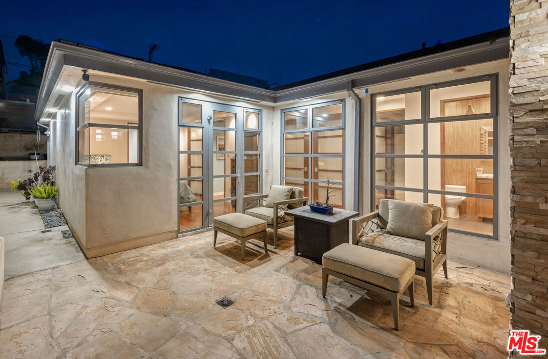 7350 Rindge Avenue Playa del Rey, CA 90293 - Photo 34 of 55 a living room with furniture and floor to ceiling windows