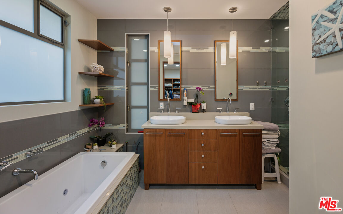 7350 Rindge Avenue Playa del Rey, CA 90293 - Photo 36 of 55 a bathroom with a tub sink and mirror