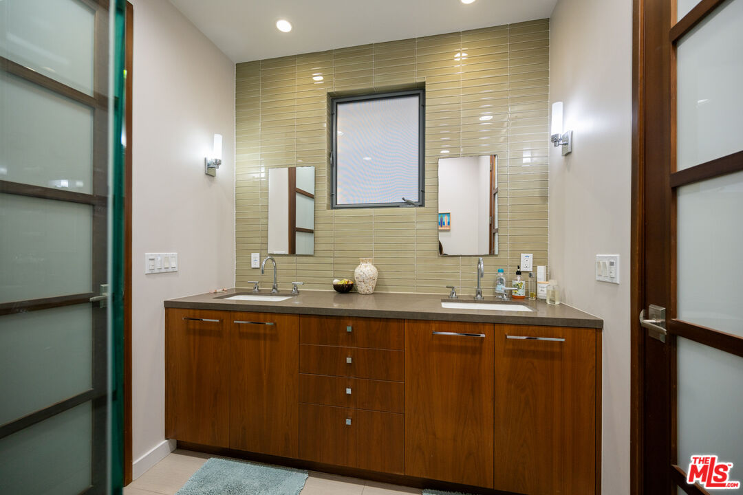 7350 Rindge Avenue Playa del Rey, CA 90293 - Photo 37 of 55 a bathroom with a double vanity sink and mirror