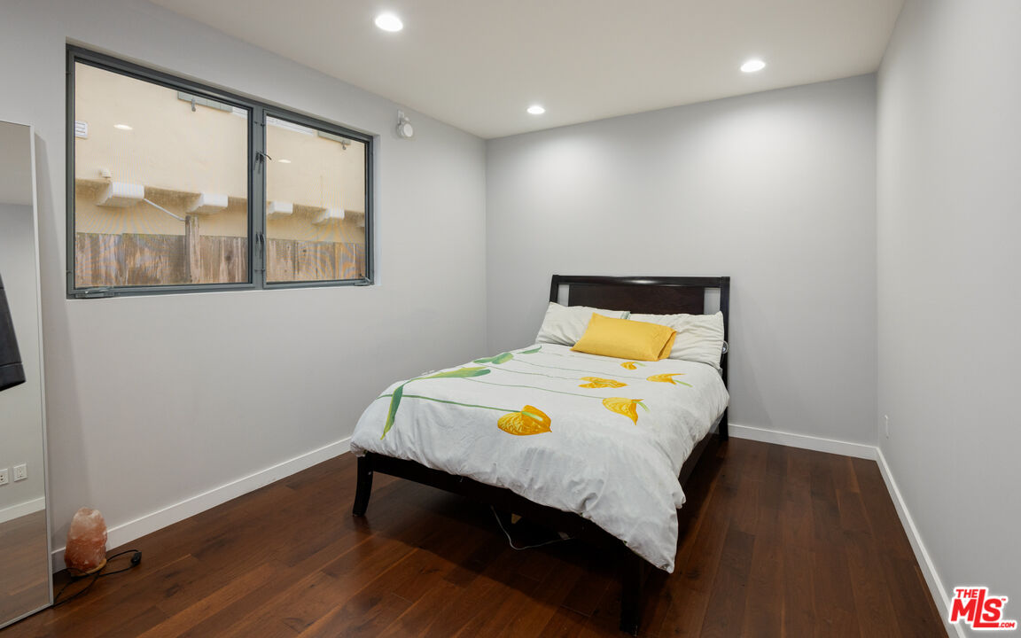 7350 Rindge Avenue Playa del Rey, CA 90293 - Photo 41 of 55 a bedroom with a bed and wooden floor