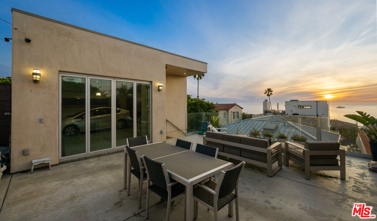 7350 Rindge Avenue Playa del Rey, CA 90293 - Photo 48 of 55 a view of a patio with table and chairs and potted plants