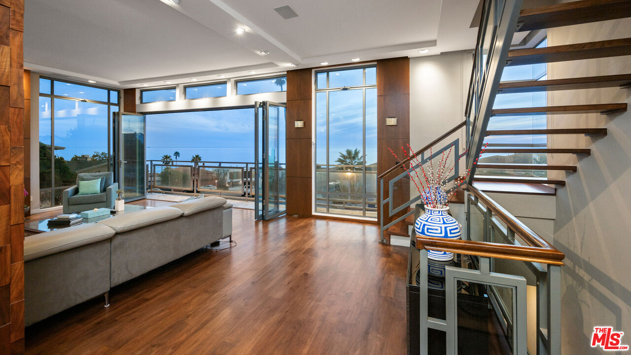 7350 Rindge Avenue Playa del Rey, CA 90293 - Photo 9 of 55 a living room with furniture and a wooden floor