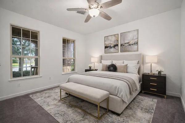 a bedroom with a bed and window