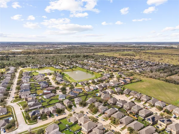 an aerial view of residential building and ocean
