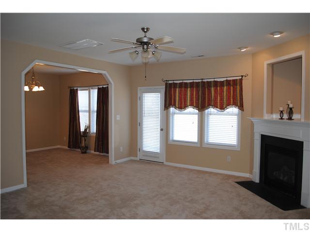 Large Family/Living room area with Fireplace. Adjoining Dining Room