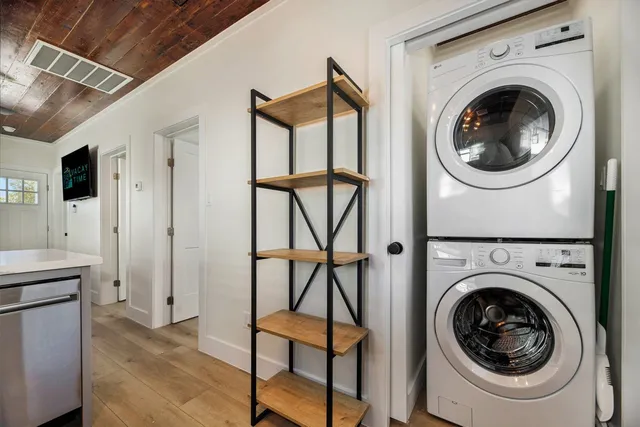 a view of a hallway with washer and dryer