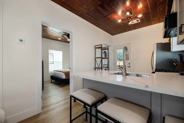 a dining room with a table and chairs