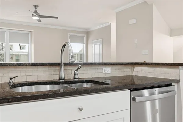 a kitchen with granite countertop a sink and a granite top