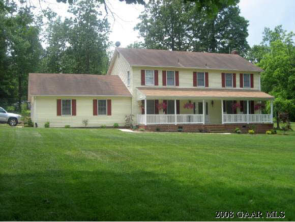 787 Oak Grove Church Road Waynesboro, VA 22980 - Photo 1 of 4 a front view of a house with a garden
