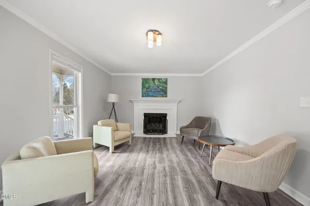 a bathroom with a granite countertop sink a mirror and shower
