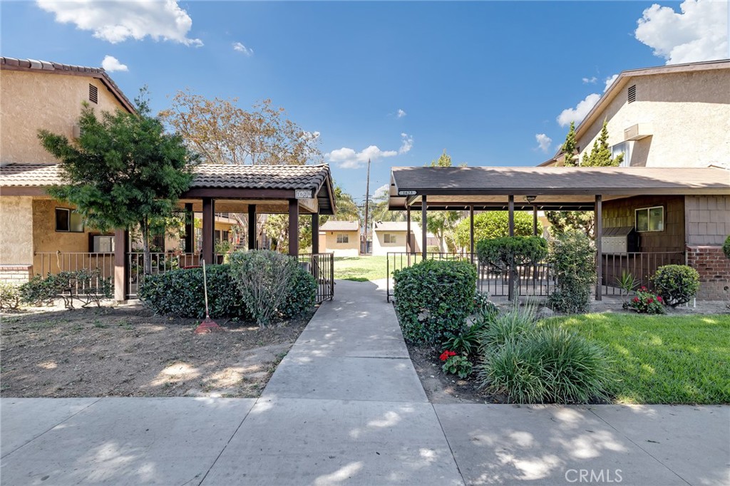 1629 West Ball Road Anaheim, CA 92802 - Photo 2 of 21 a view of a pathway with a house in the background