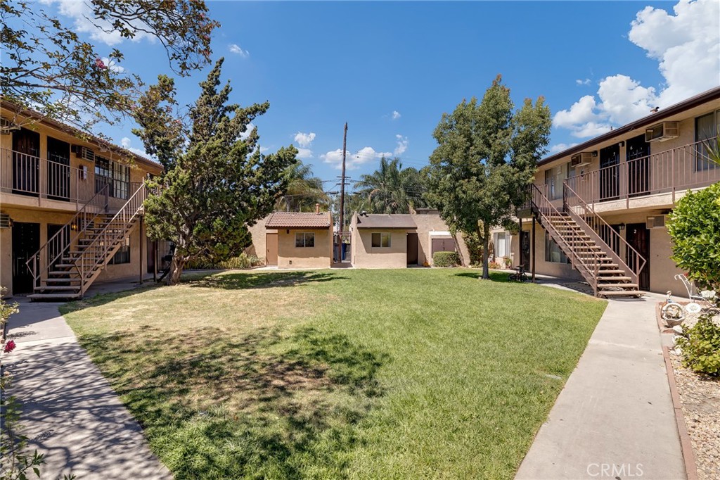 1629 West Ball Road Anaheim, CA 92802 - Photo 5 of 21 a front view of a house with a garden