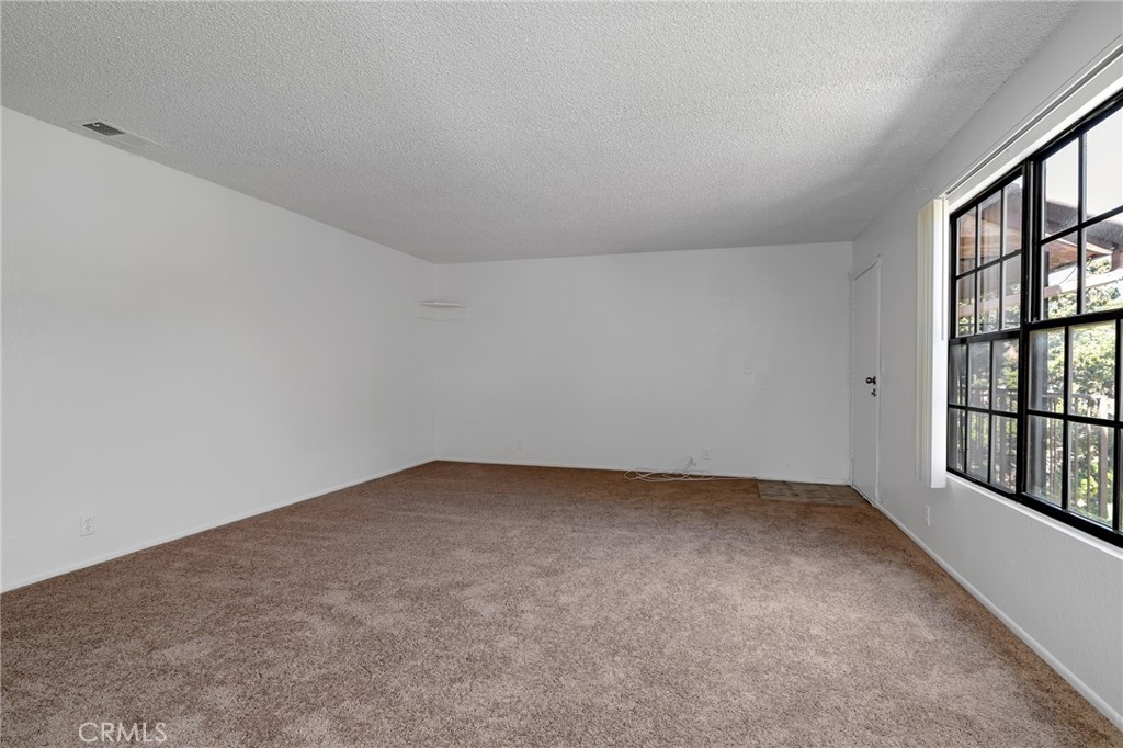 1629 West Ball Road Anaheim, CA 92802 - Photo 7 of 21 an empty room with windows
