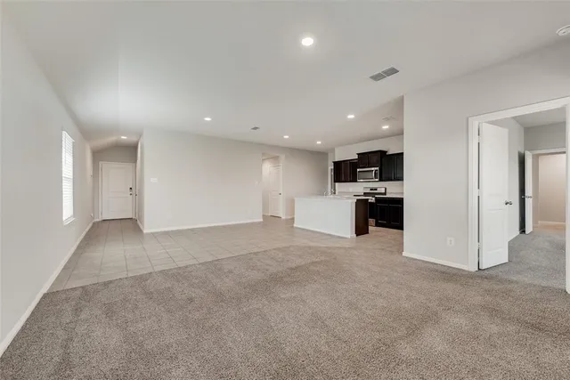a kitchen with a sink a stove and refrigerator
