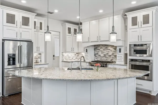 a kitchen with counter top space cabinets and stainless steel appliances