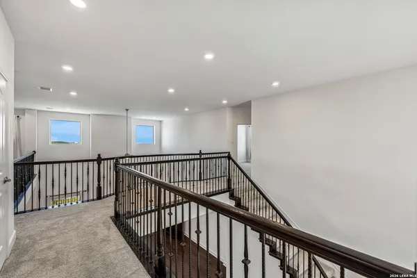 a view of staircase with wooden floor