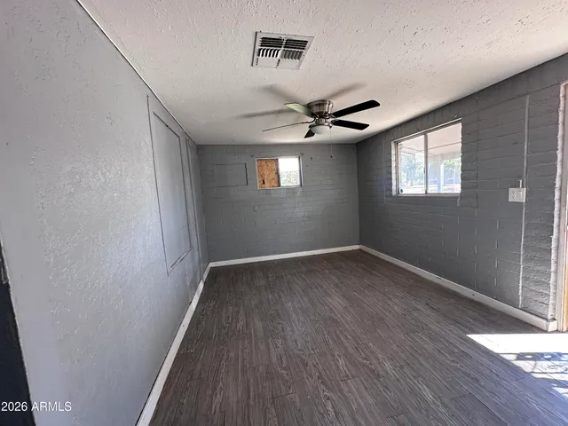 a kitchen with stove and cabinets