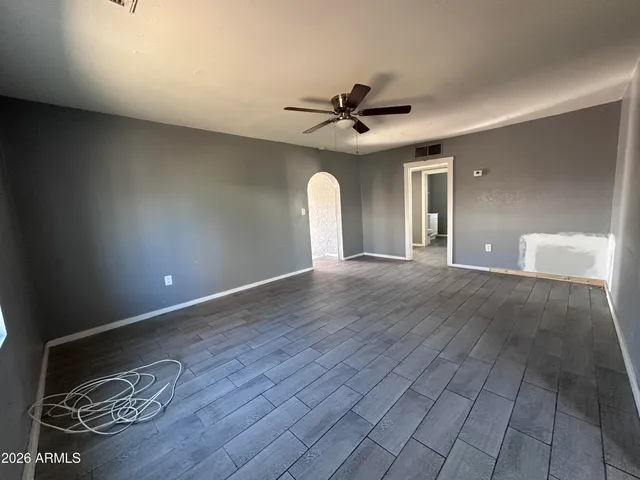 a kitchen with granite countertop a sink cabinets and stainless steel appliances