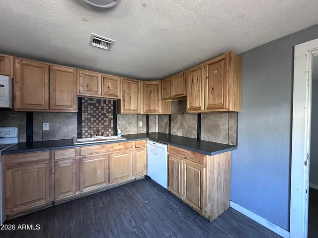 a bathroom with a sink a mirror and a shower
