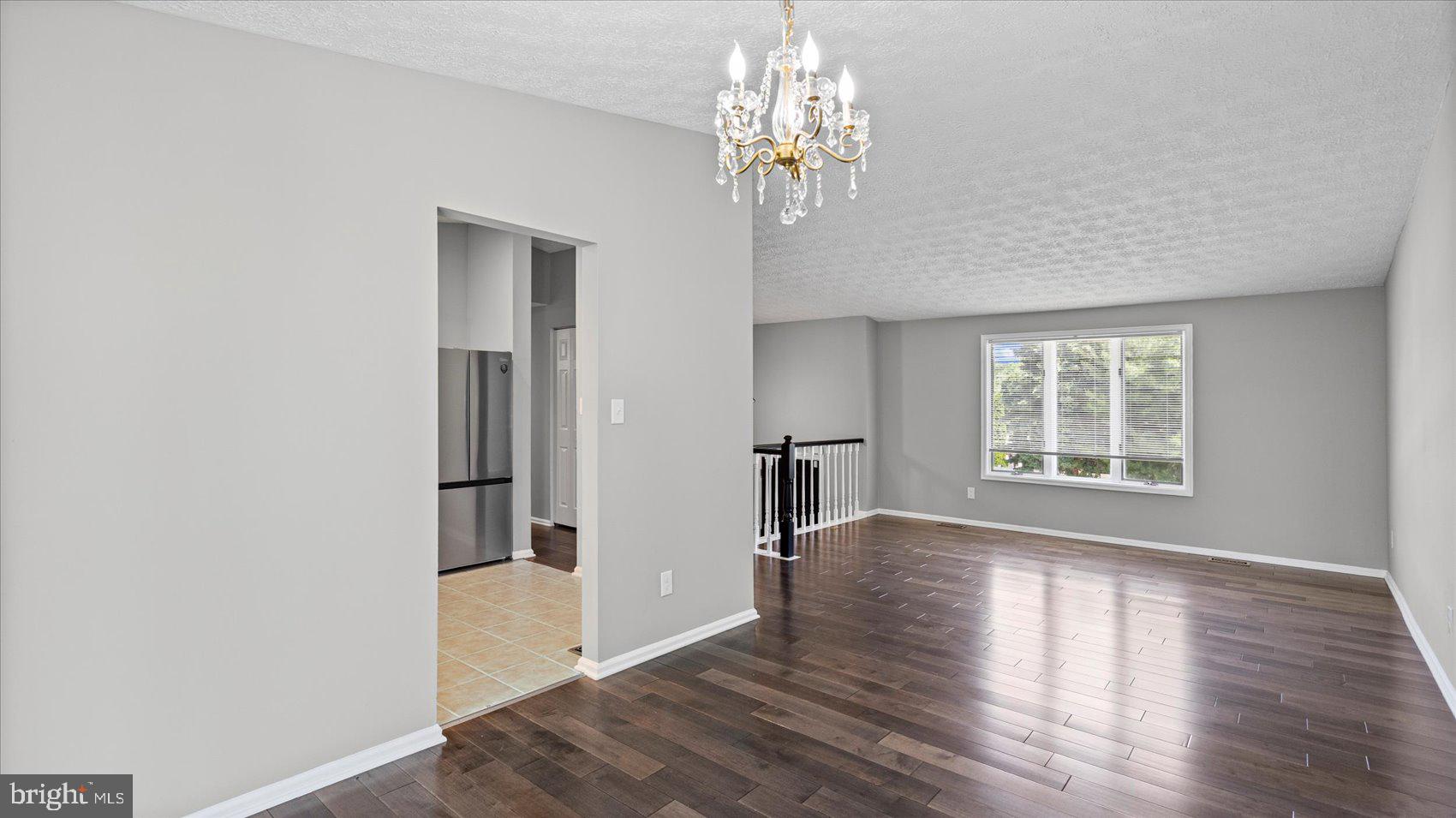 3709 Redberry Way Nottingham, MD 21236 - Photo 11 of 45 wooden floor in an empty room with a window