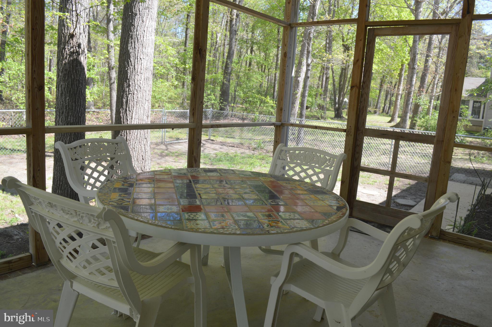 26610 Quantico Creek Road Hebron, MD 21830 - Photo 9 of 56 SCREENED PORCH INTERIOR