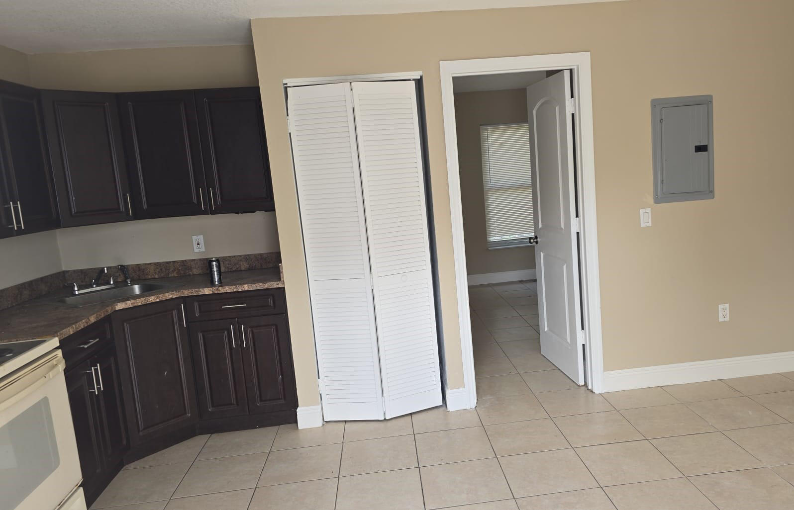 900 Avenue H, Unit 916 Riviera Beach, FL 33404 - Photo 2 of 4 a view of a kitchen with a sink and dishwasher