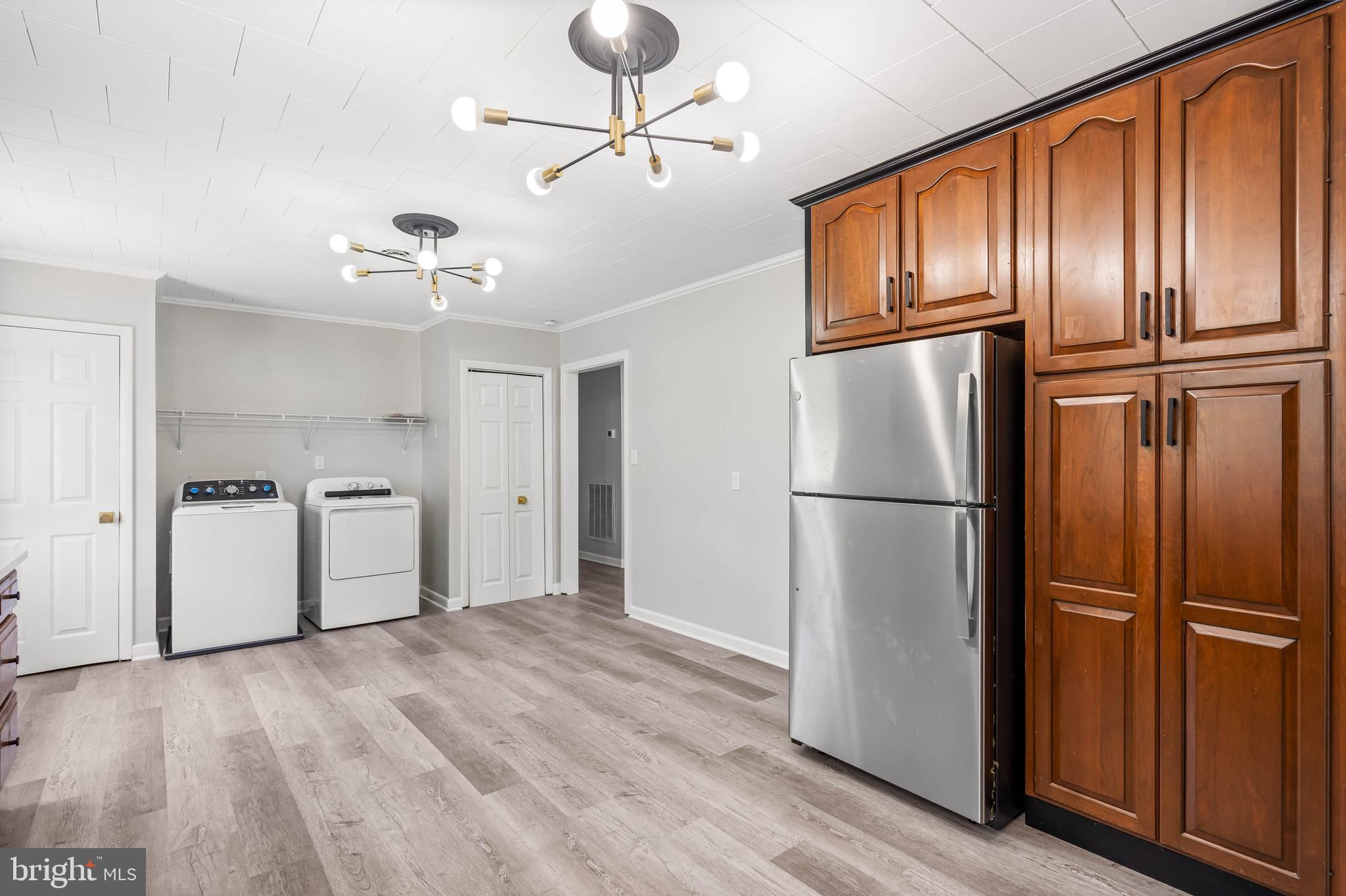 34132 Clay Road Lewes, DE 19958 - Photo 11 of 32 a view of kitchen with stainless steel appliances wooden floor and cabinets