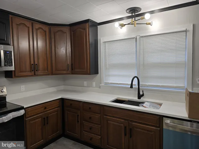 a kitchen with a sink and cabinets