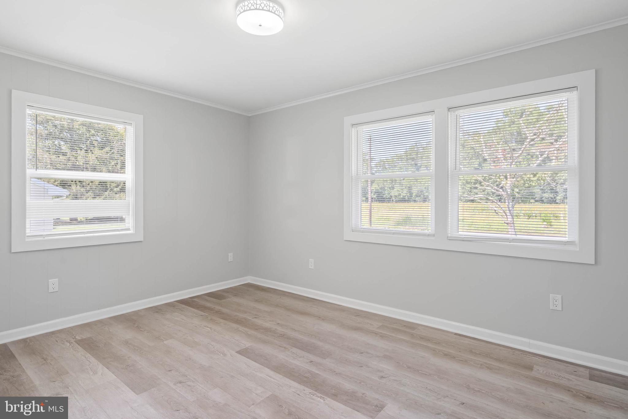 34132 Clay Road Lewes, DE 19958 - Photo 21 of 32 a view of a room with wooden floor and windows