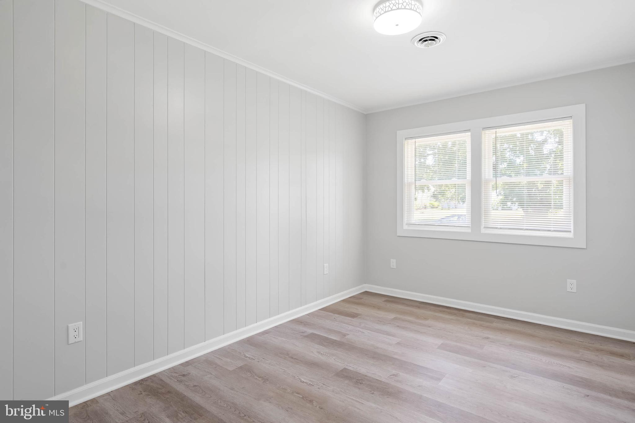34132 Clay Road Lewes, DE 19958 - Photo 26 of 32 wooden floor in an empty room with a window