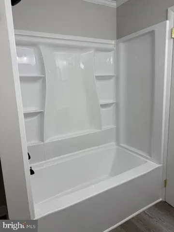 a close view of bathtub in closet