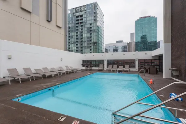 a view of a swimming pool with chairs
