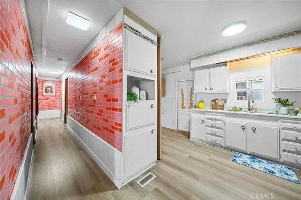 a kitchen with stainless steel appliances a refrigerator and a stove