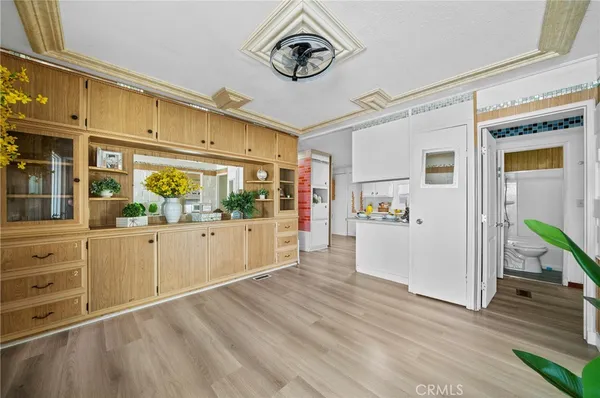 a view of an entryway with wooden floor