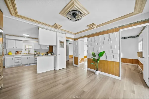 a view of a living room and kitchen